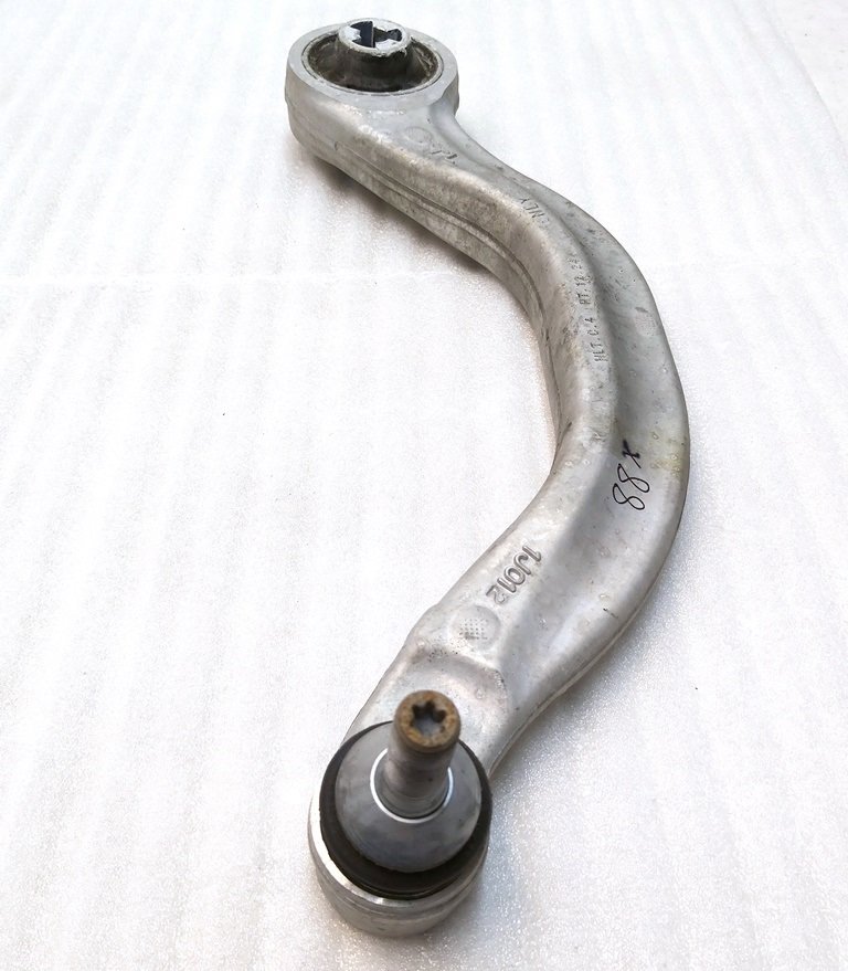 Nedre venstre spak foran (banan) for restaurering Tesla modell 3, modell Y 1044354-00-A