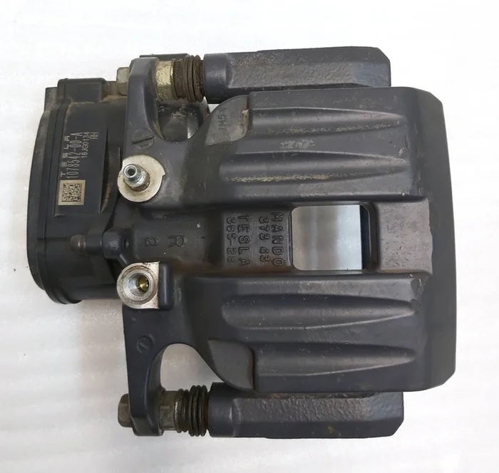 Remklauw rechts achter MANDO zonder remblokken en voering TESLA Tesla model S REST, model X 1097415-00-A
